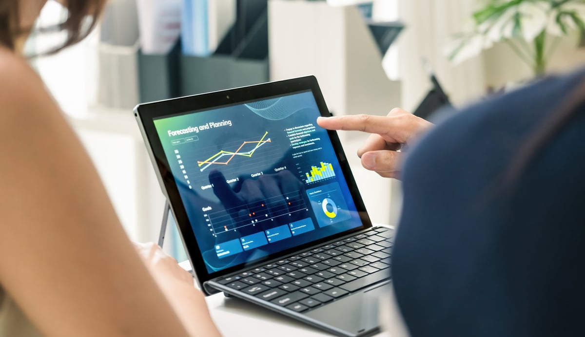 A team discussing financial data and strategy in a modern office